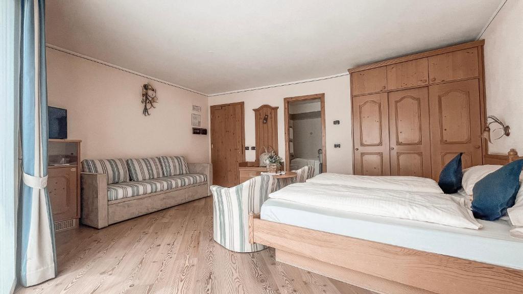 Posteľ alebo postele v izbe v ubytovaní Hotel Flora