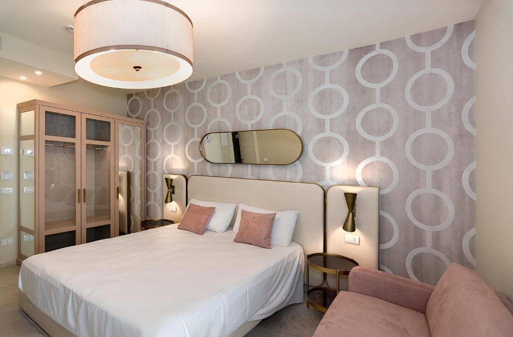 Postel nebo postele na pokoji v ubytování Hotel Mariotti