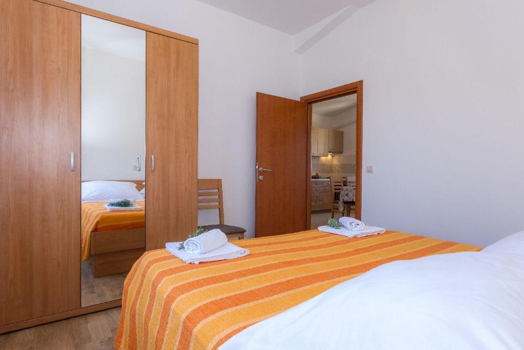 Posteľ alebo postele v izbe v ubytovaní Apartments Zvone1