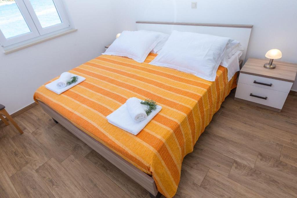 Posteľ alebo postele v izbe v ubytovaní Apartments Zvone1