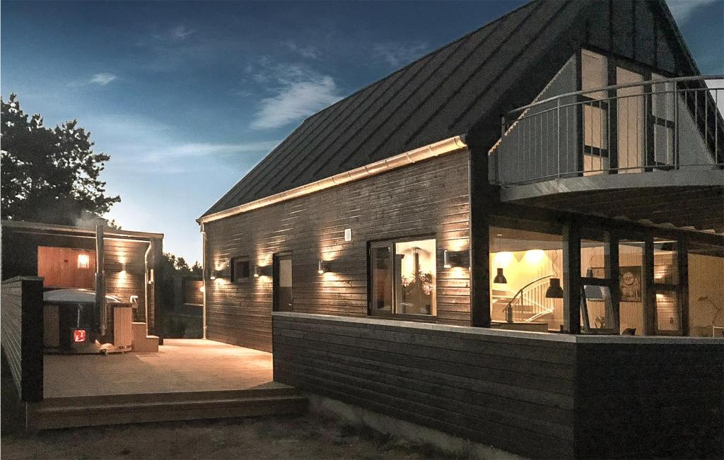 a brick house with a window on the side of it at Three-Bedroom Holiday Home In Romo in Sønderby