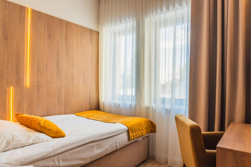 Postel nebo postele na pokoji v ubytování Dom Wczasowy Zew Morza - Basen, Spa, Wyżywienie w Cenie