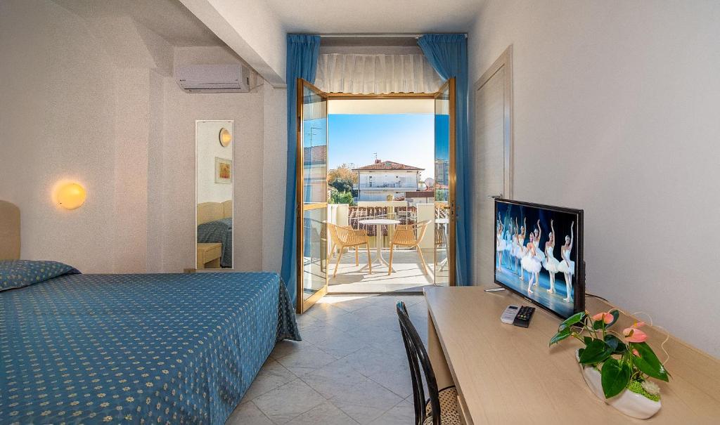 Postel nebo postele na pokoji v ubytování Hotel Mariotti