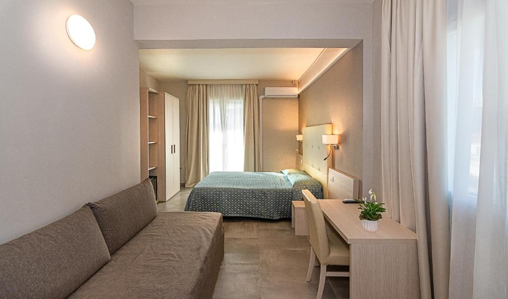 Postel nebo postele na pokoji v ubytování Hotel Mariotti