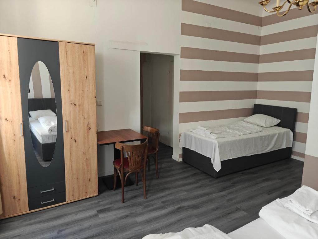 Postel nebo postele na pokoji v ubytování Hotel Viki