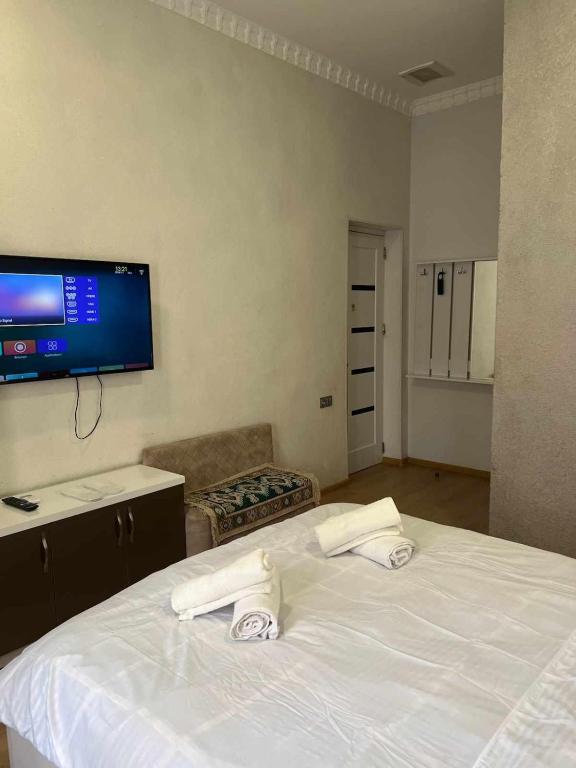 Postel nebo postele na pokoji v ubytování Cozy Rooms Tbilisi