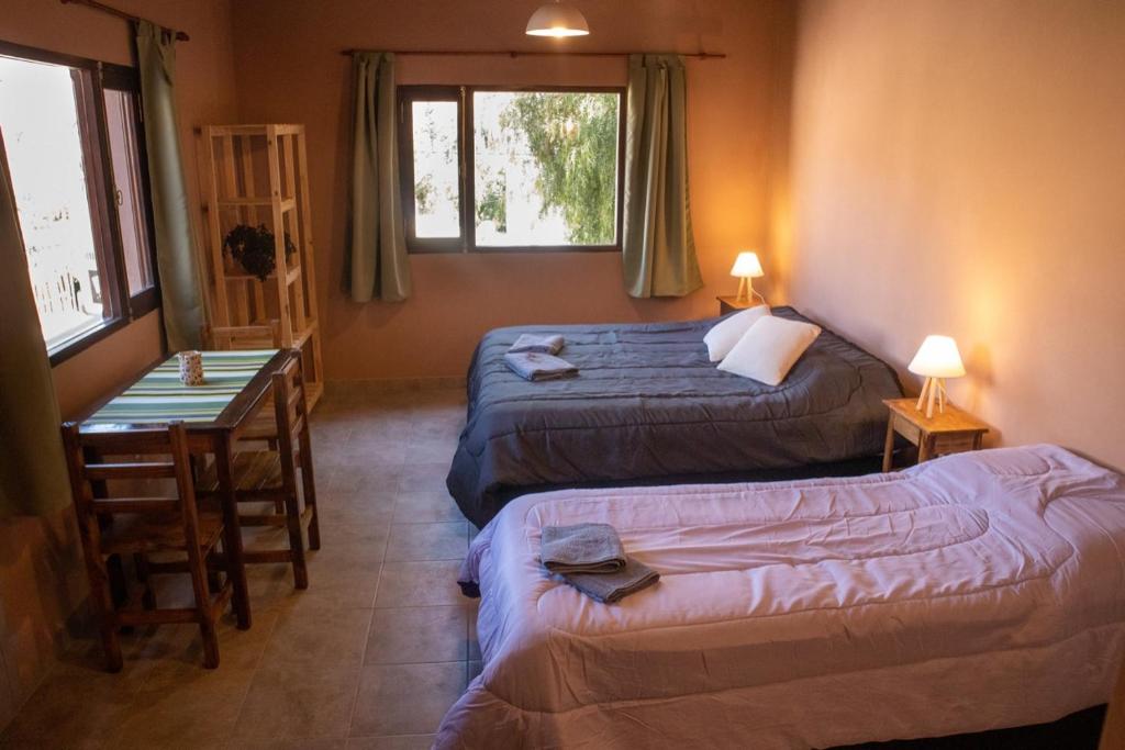 Postel nebo postele na pokoji v ubytování El Aromito Hospedaje