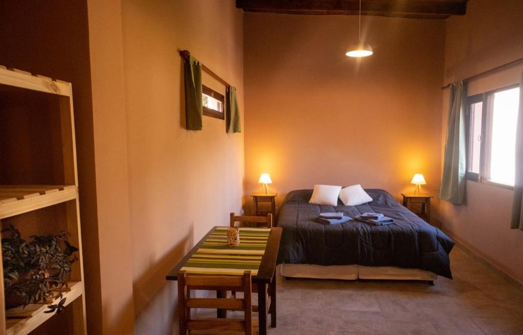 Postel nebo postele na pokoji v ubytování El Aromito Hospedaje