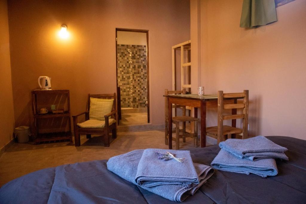 Postel nebo postele na pokoji v ubytování El Aromito Hospedaje