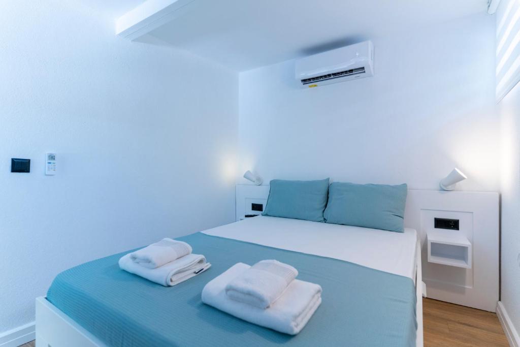 Postel nebo postele na pokoji v ubytování Villa Italic Suites