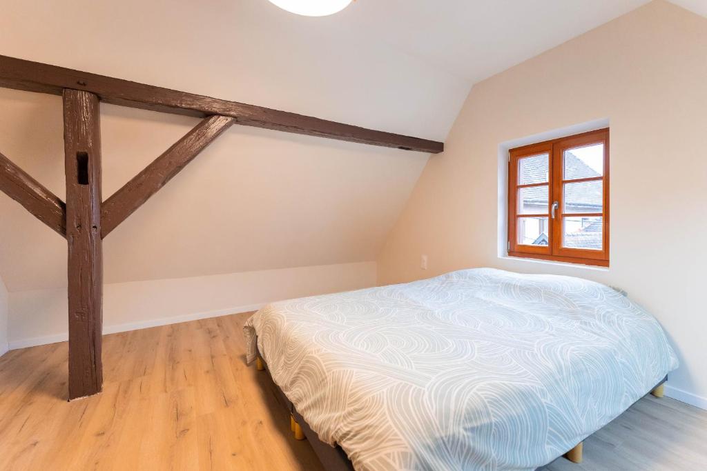 Postel nebo postele na pokoji v ubytování Zellenberg - Gîte d'Aksel