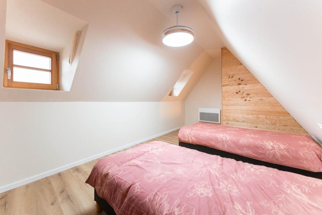 Postel nebo postele na pokoji v ubytování Zellenberg - Gîte d'Aksel