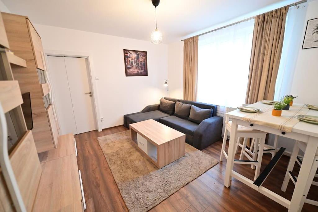a living room with a couch and a table at FLH - The Great Novel in Sibiu