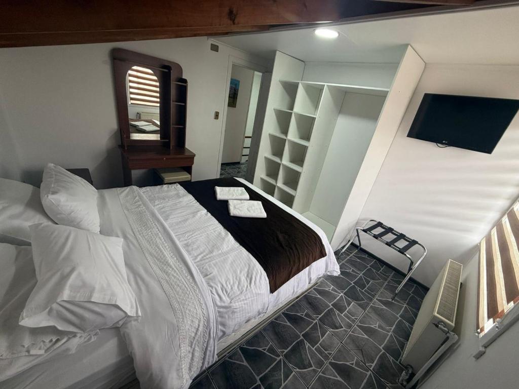 Postel nebo postele na pokoji v ubytování Cabañas Última Esperanza