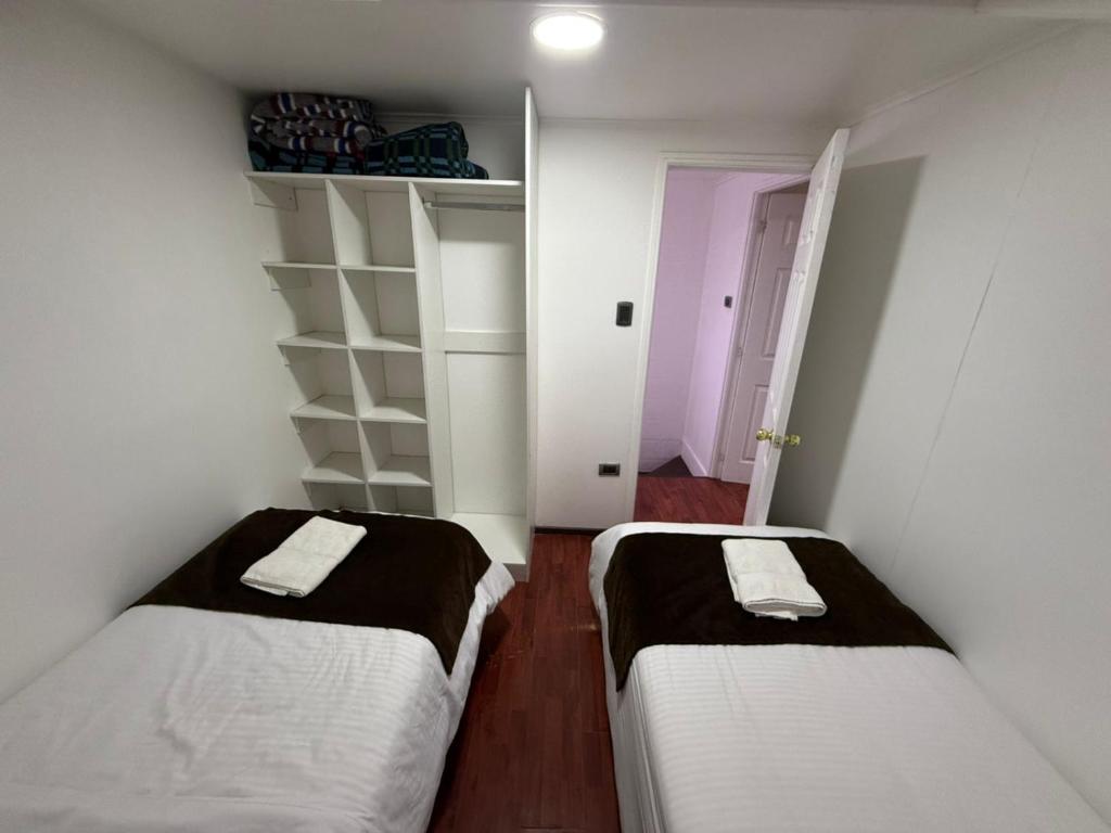 Postel nebo postele na pokoji v ubytování Cabañas Última Esperanza