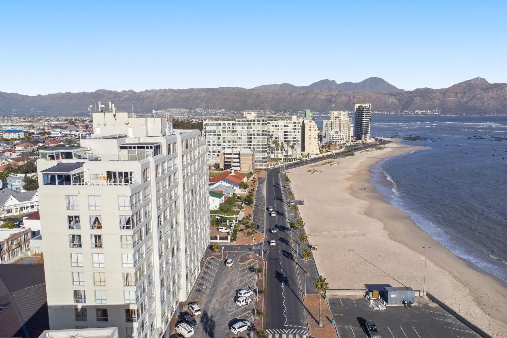 a view of a beach and buildings and the ocean at Odeon Towers 1102 in Strand