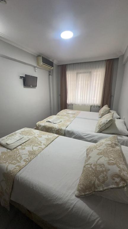 A bed or beds in a room at Amore Hotel Istanbul