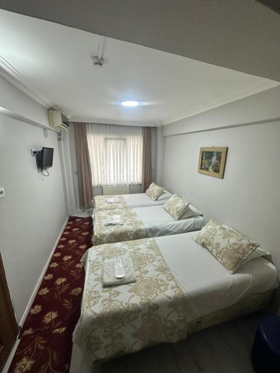 A bed or beds in a room at Amore Hotel Istanbul
