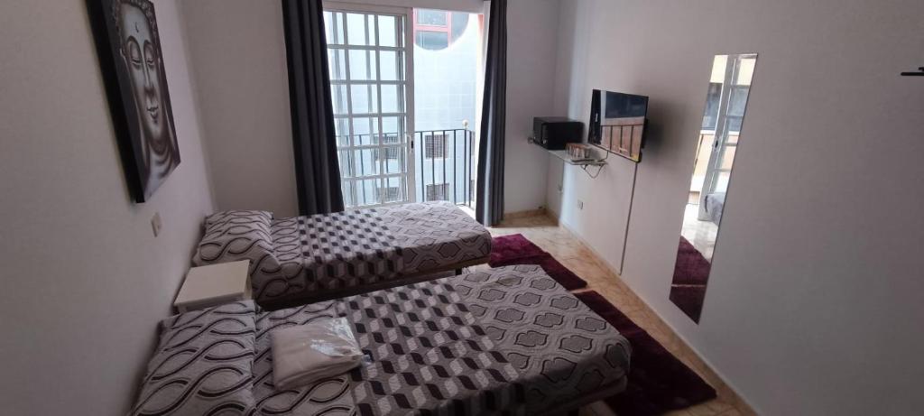 Кровать или кровати в номере Vivienda San Justo