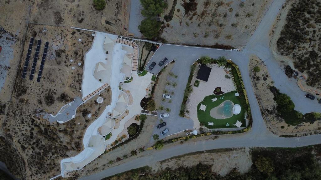 an overhead view of a park with a building at Complejo Cuevas Otto in Baza
