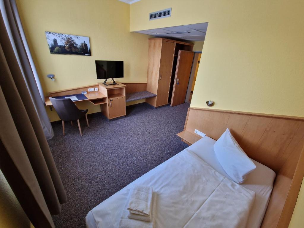 Postel nebo postele na pokoji v ubytování Hotel A2