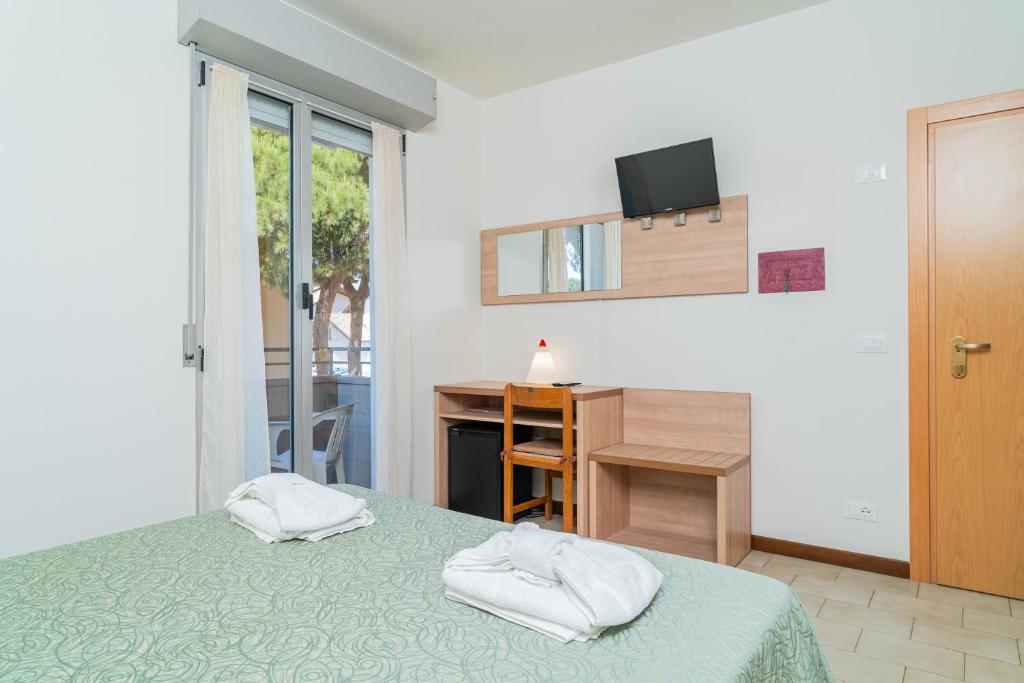 Postel nebo postele na pokoji v ubytování Hotel Ondina e Milazzo