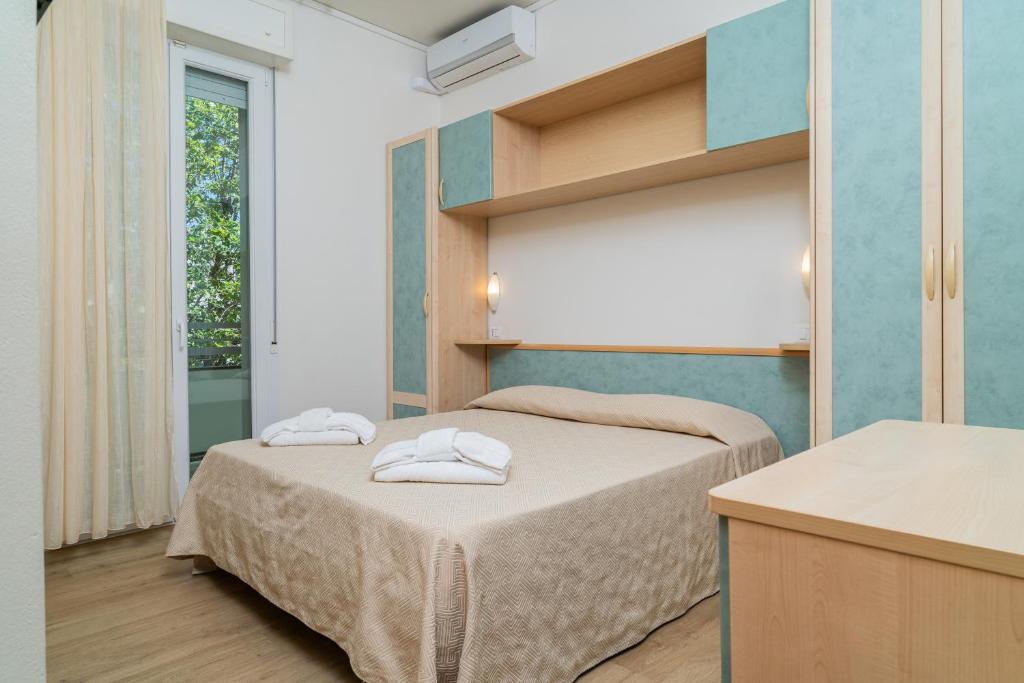 Postel nebo postele na pokoji v ubytování Hotel Ondina e Milazzo