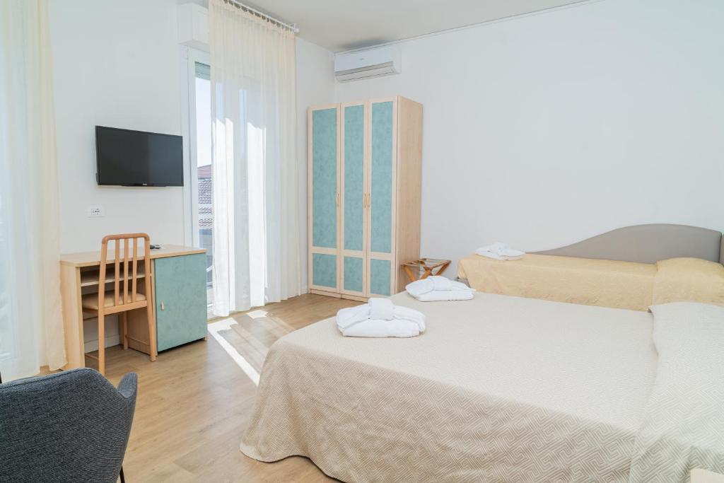 Postel nebo postele na pokoji v ubytování Hotel Ondina e Milazzo