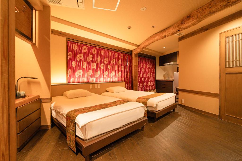 Postel nebo postele na pokoji v ubytování 都電屋 TodenHotel