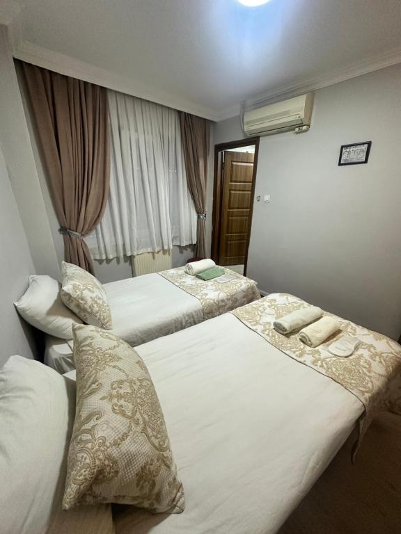 A bed or beds in a room at Amore Hotel Istanbul