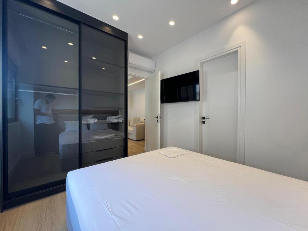 Postel nebo postele na pokoji v ubytování BlueMotion - CruiseNest Complex