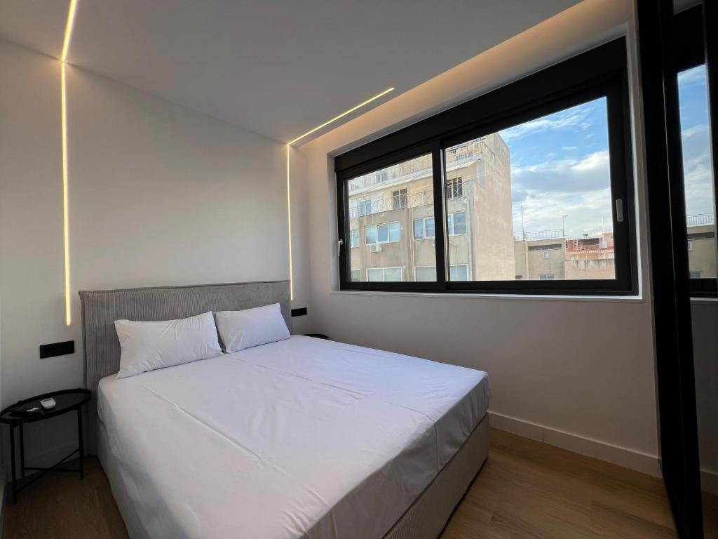 Postel nebo postele na pokoji v ubytování BlueMotion - CruiseNest Complex