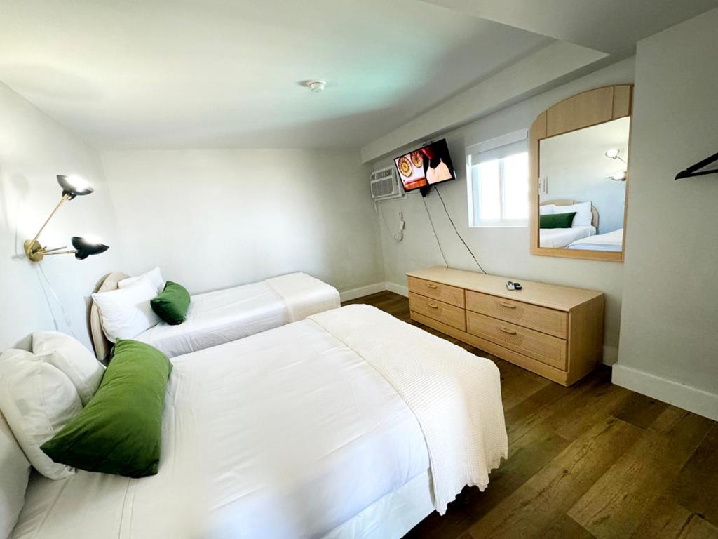 Postel nebo postele na pokoji v ubytování Coliseum Ocean Resort