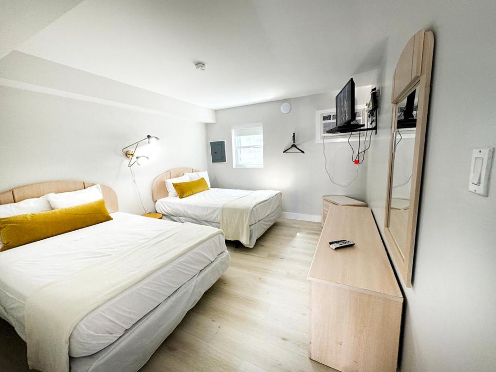 Postel nebo postele na pokoji v ubytování Coliseum Ocean Resort