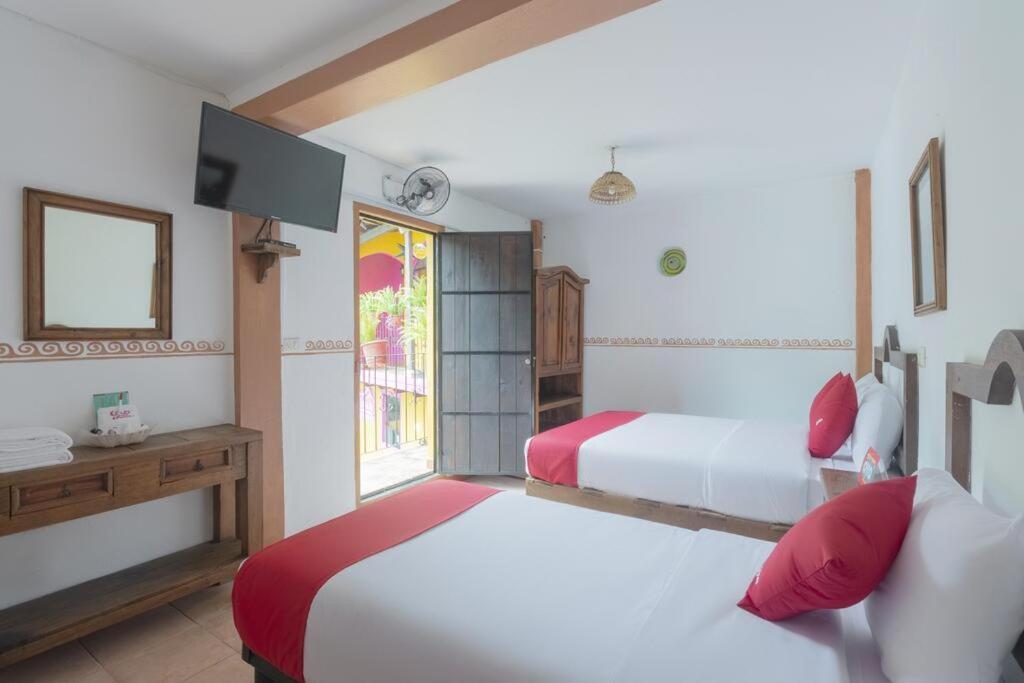 Postel nebo postele na pokoji v ubytování Hotel Coyopolan