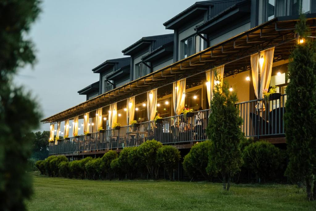 a large building with lights on the balcony at Balka Eco Club in Glubokaya Balka