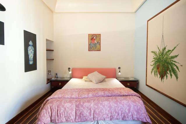 Łóżko lub łóżka w pokoju w obiekcie Chiaia B&B