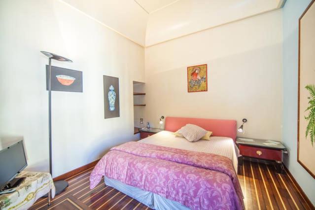 Łóżko lub łóżka w pokoju w obiekcie Chiaia B&B