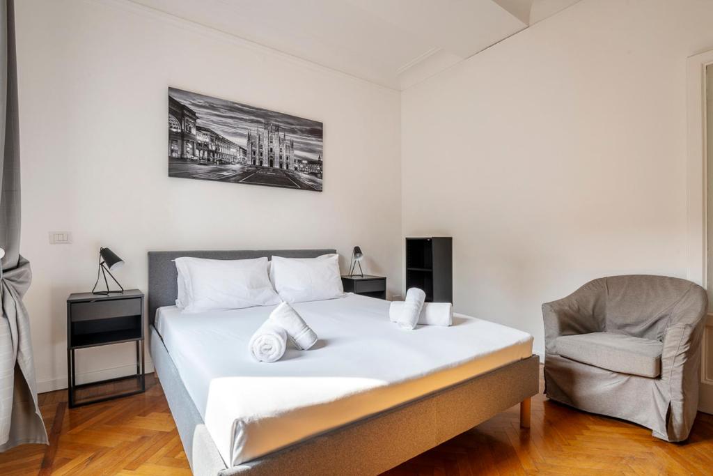 Łóżko lub łóżka w pokoju w obiekcie Exclusive 3 bedrooms apartment in Brera