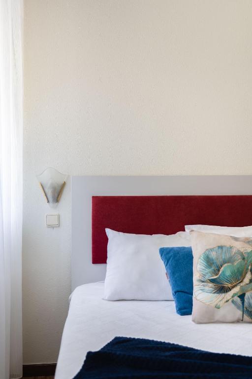 Postel nebo postele na pokoji v ubytování Residencial Clássico