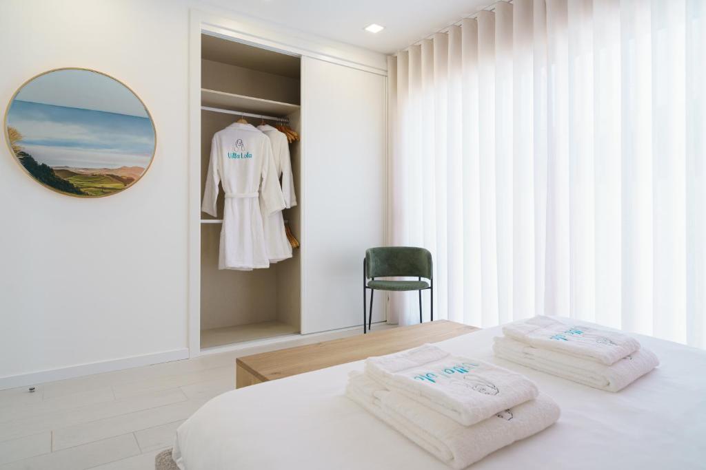 Ein Bett oder Betten in einem Zimmer der Unterkunft Villa Lola