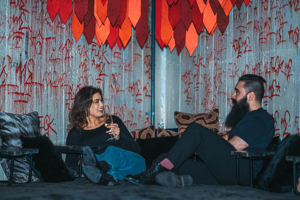 a man and a woman sitting on a couch at Generator Stockholm in Stockholm