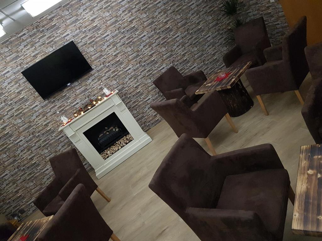 TV a/nebo společenská místnost v ubytování Hotel A2