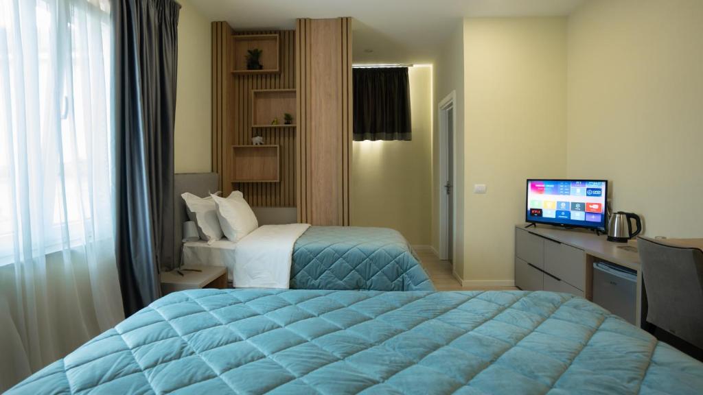 Postel nebo postele na pokoji v ubytování F&M Hotel 2