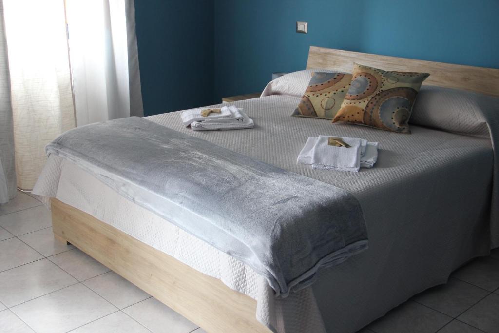 Postel nebo postele na pokoji v ubytování Casa Vacanze Sud e Magia