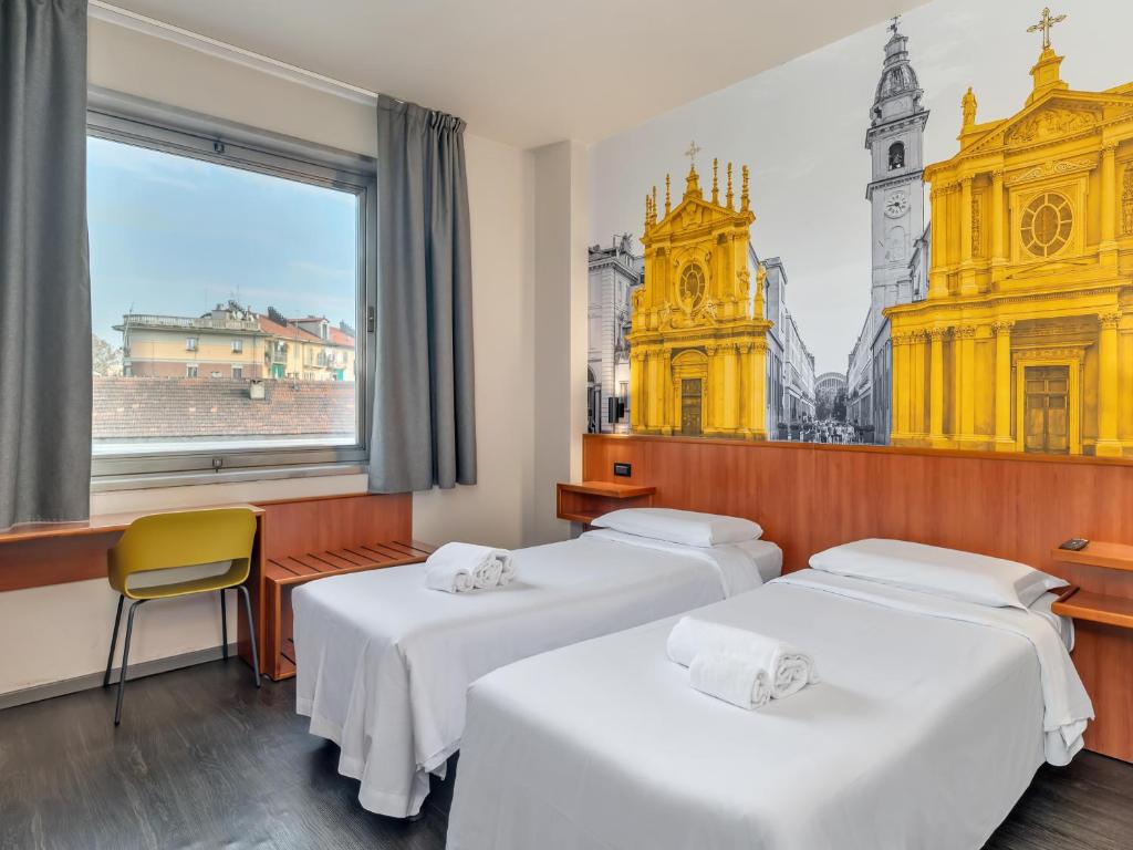 Postel nebo postele na pokoji v ubytování B&B Hotel Torino President
