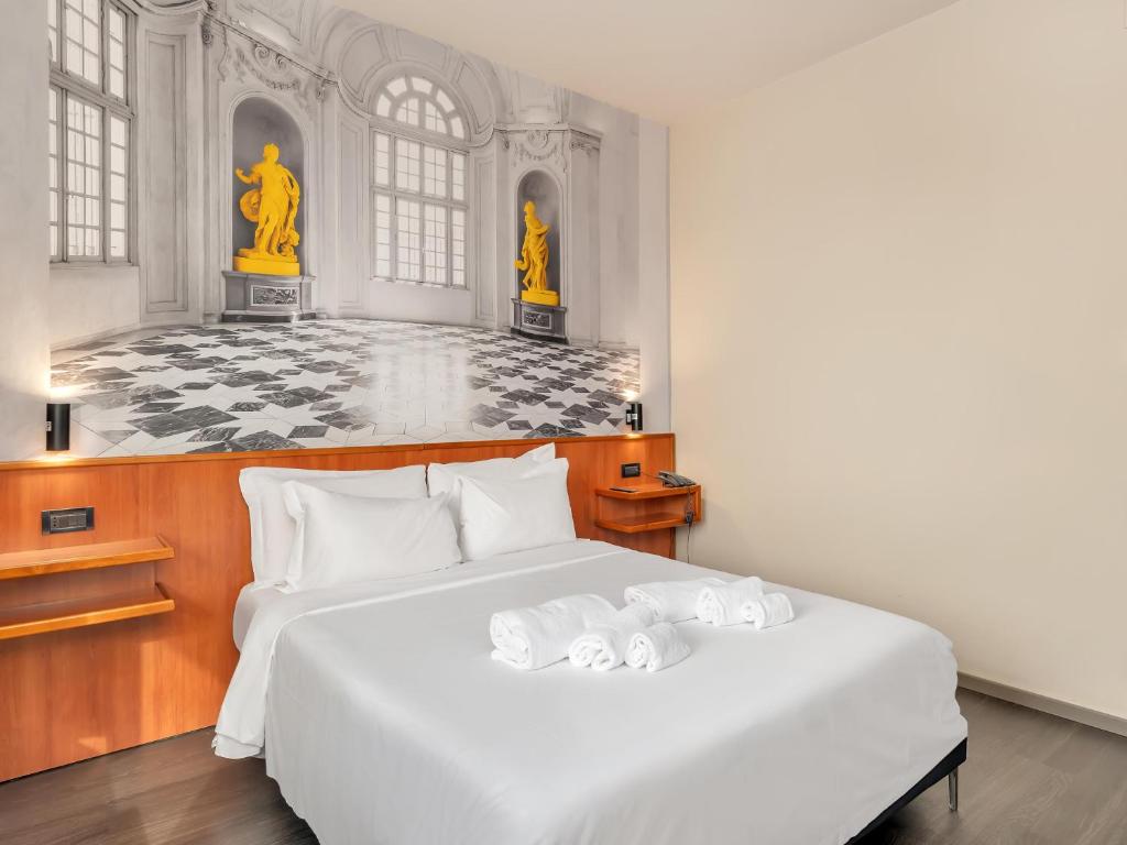 Postel nebo postele na pokoji v ubytování B&B Hotel Torino President