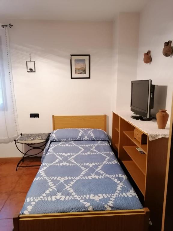 Postel nebo postele na pokoji v ubytování El Castillejo de Camarena de la Sierra