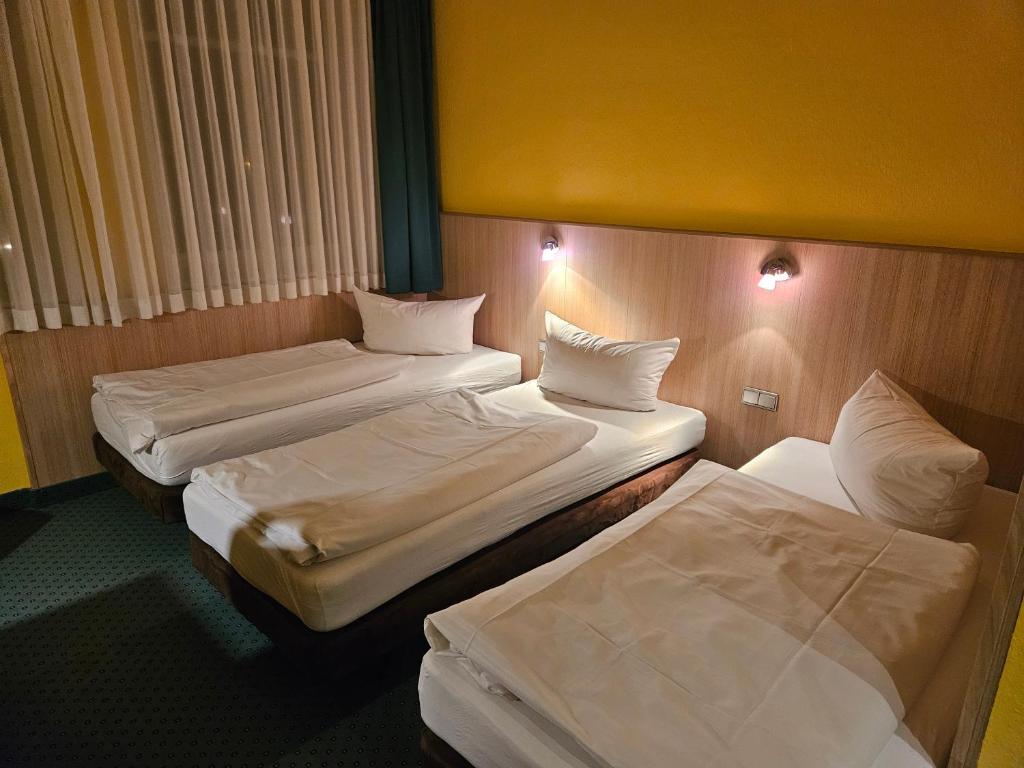 Postel nebo postele na pokoji v ubytování Hotel A2