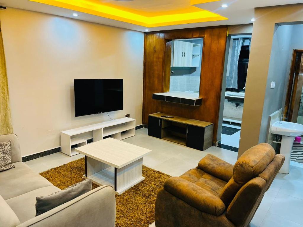 TV a/nebo společenská místnost v ubytování Amam Hotel